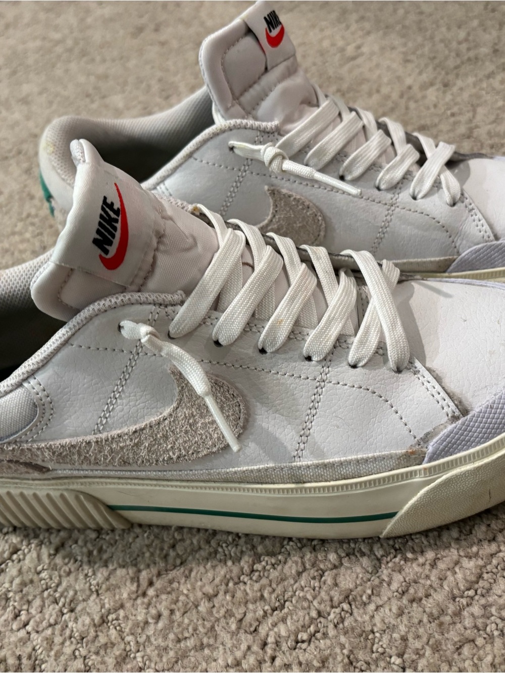 Nike White Low-Top Sneakers with Cream Suede Swoosh and Green Stripe